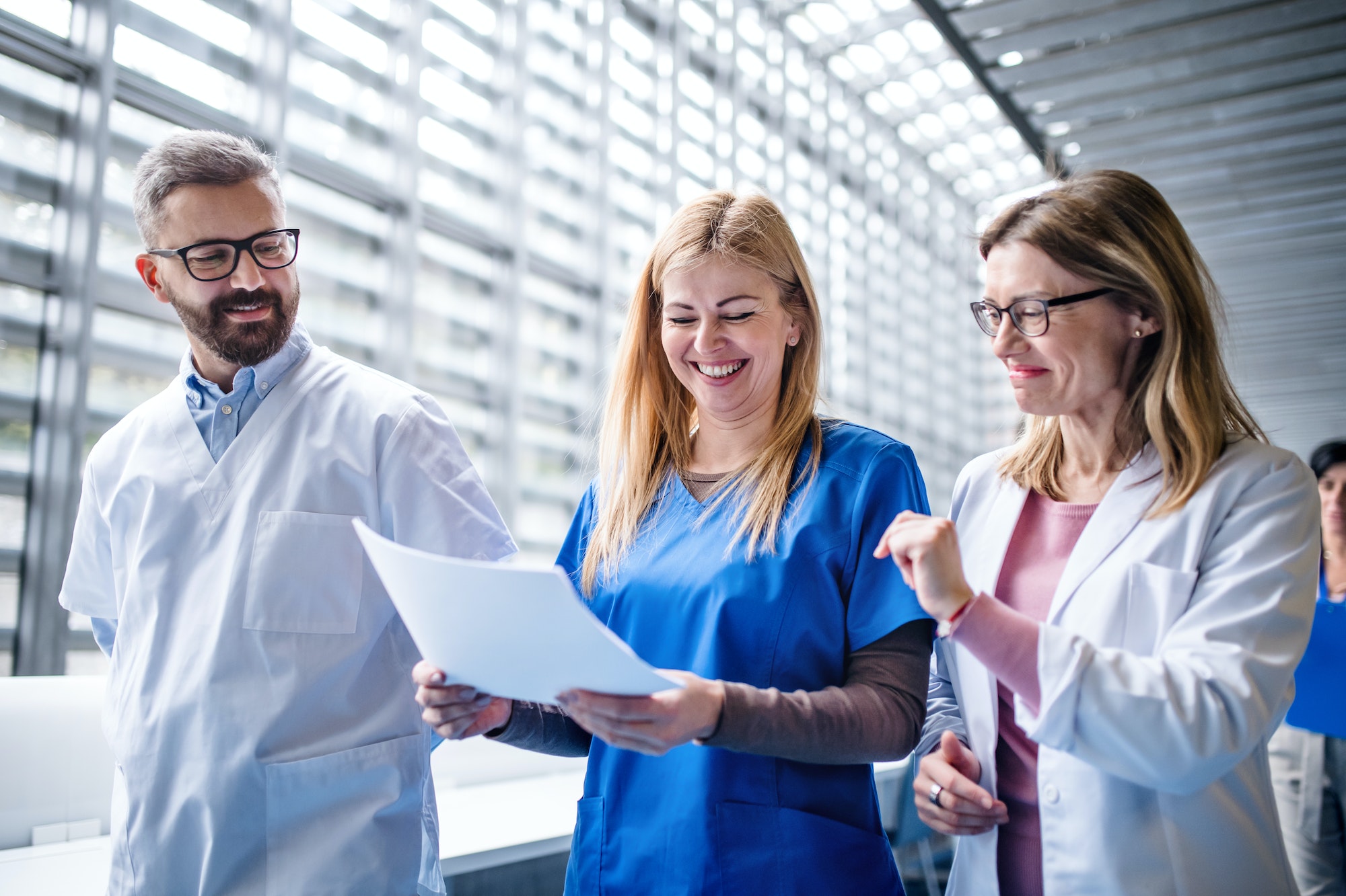 Group of doctors walking in corridor on medical conference