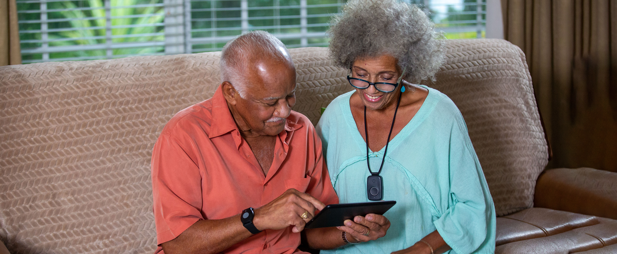 Senior couple using tablet